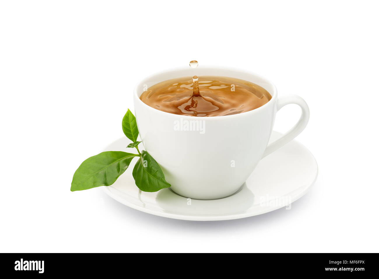 cup of tea with leaves and drop splashing, on white background Stock
