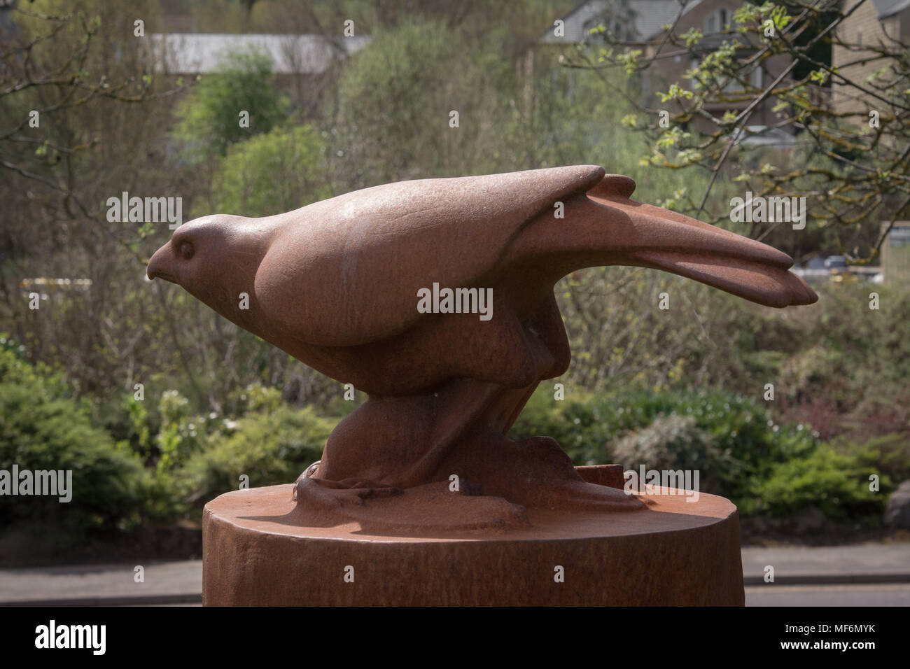 Sculpture, 'The Hawk' a tribute to Yorkshire poet Ted Hughes by sculptor Kenny Hunter. Mytholmroyd,  Ted Hughes's birthplace, is in the background. Stock Photo