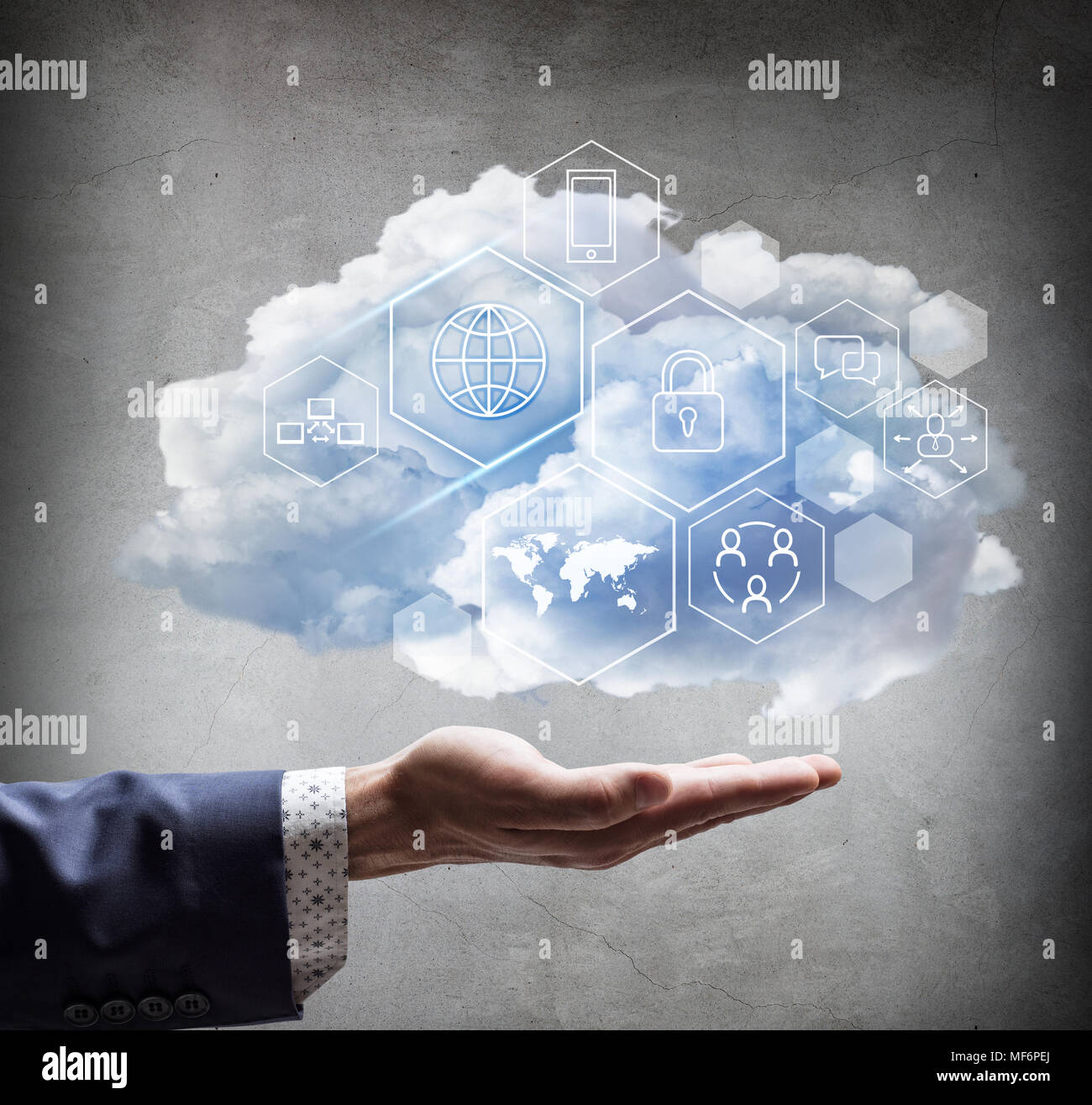 Hand holding cloud with different digital icons. Stock Photo