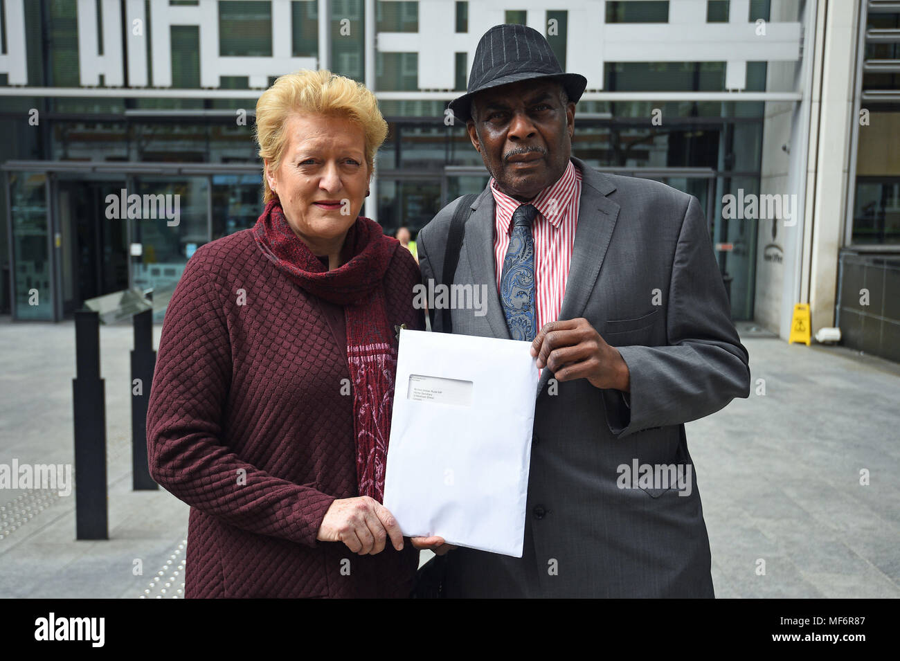 Neville Lawrence, the father of murdered teenager Stephen Lawrence, and undercover policing tactics victim Sharon Grant hold a letter addressed to Home Secretary Amber Rudd outside the Home Office in London. Campaigners who fell prey to controversial undercover policing tactics are asking Ms Rudd to change the leadership of a public inquiry. Stock Photo