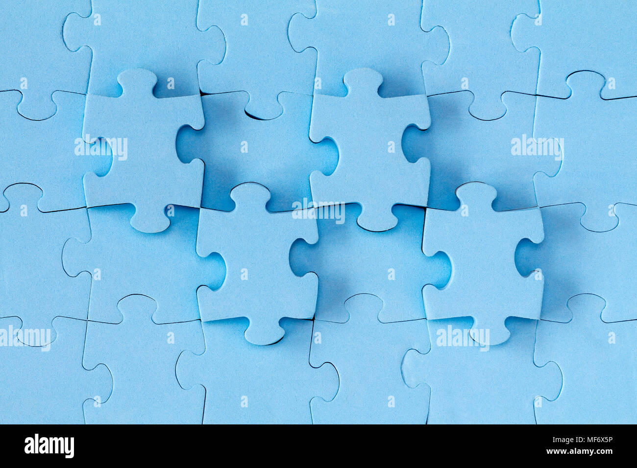 Abstract background made of blue puzzle pieces Stock Photo