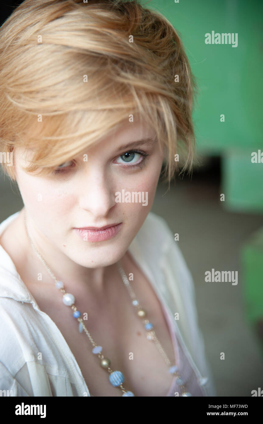 Young Blonde Short Haired Model With Fringe Over One Eye And