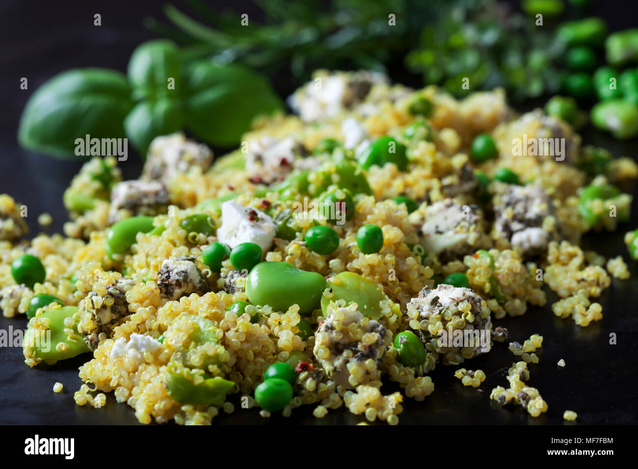 Quinoa salad with broad beans, peas and feta, closeup Stock Photo Alamy