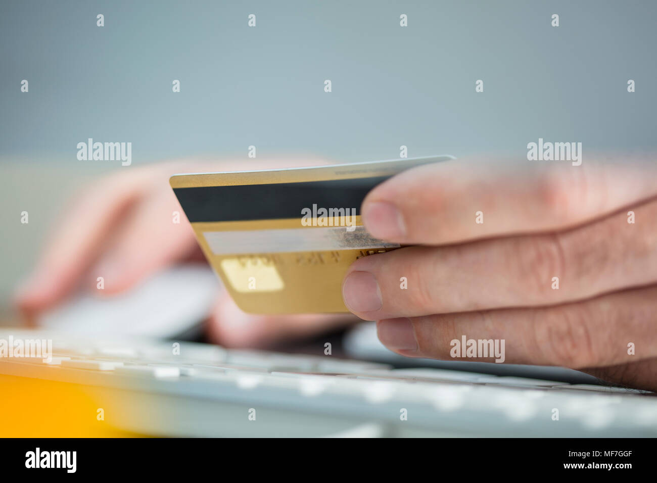 Man making online payment with credit card, close-up Stock Photo