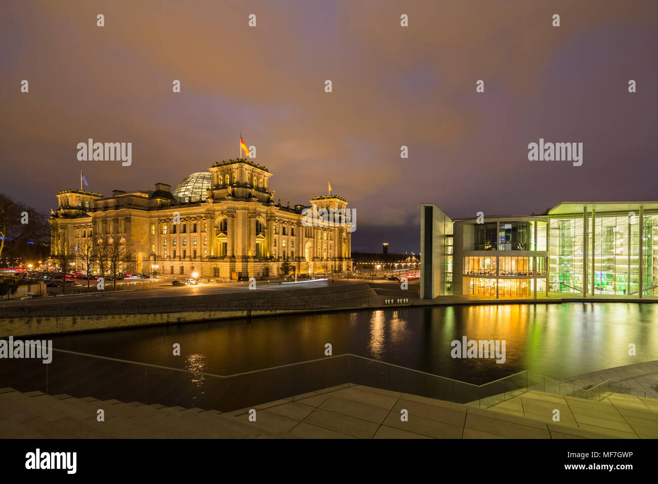 Germany, Berlin, Reichstag and Paul Loebe Government Building at Spree river in the evening Stock Photo
