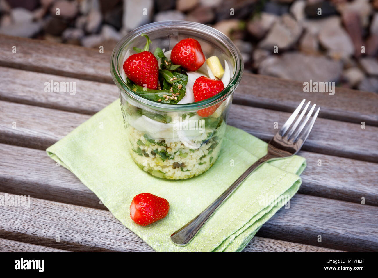 Asparagus salad with millet, strawberry, rocket in glass Stock Photo