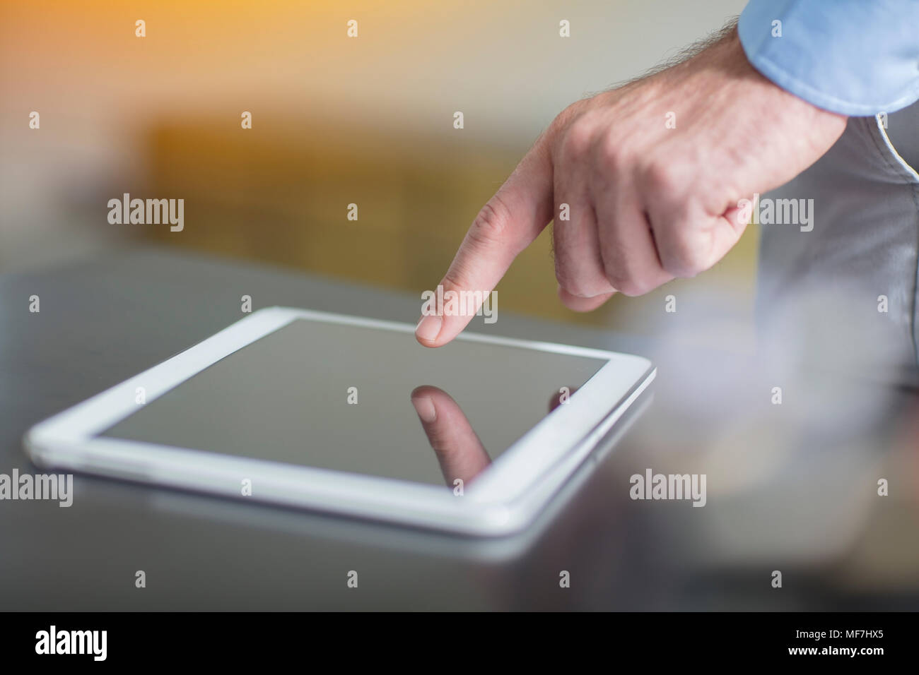 Man using tablet in office, close-up Stock Photo