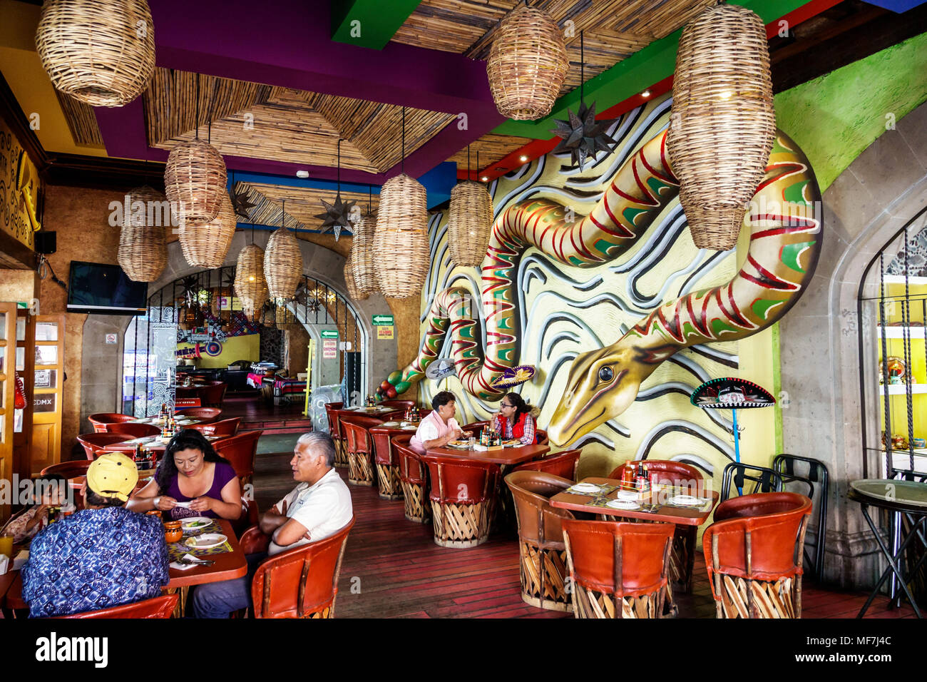 Mexico City,Hispanic,historic Center Centre,La Chilanguita,restaurant restaurants food dining cafe cafes,inside,rustic decor,Equipale leather drum cha Stock Photo