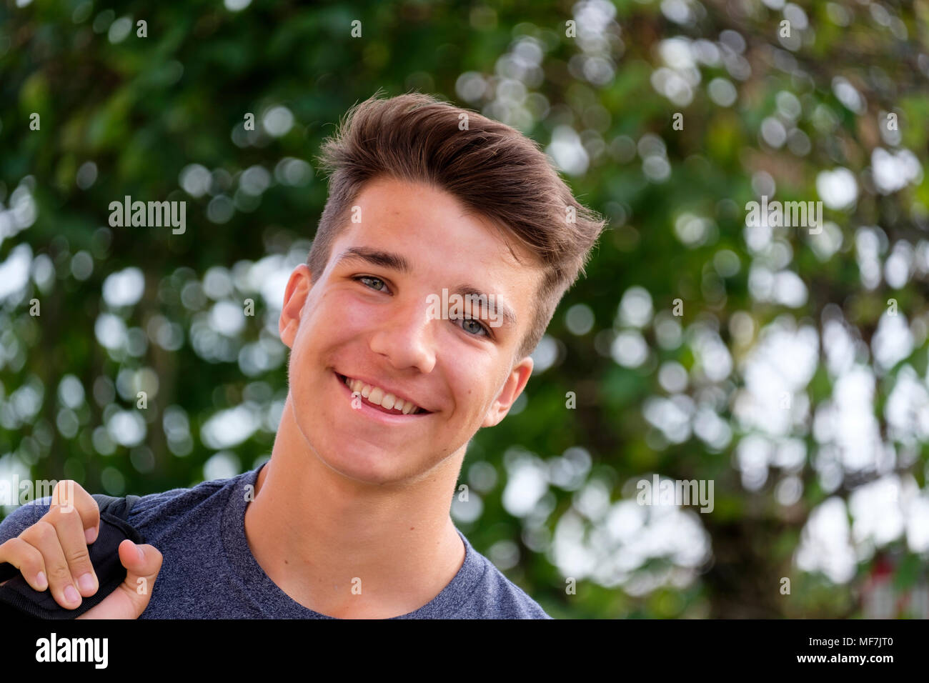 Portrait of smiling young man outdoors Stock Photo