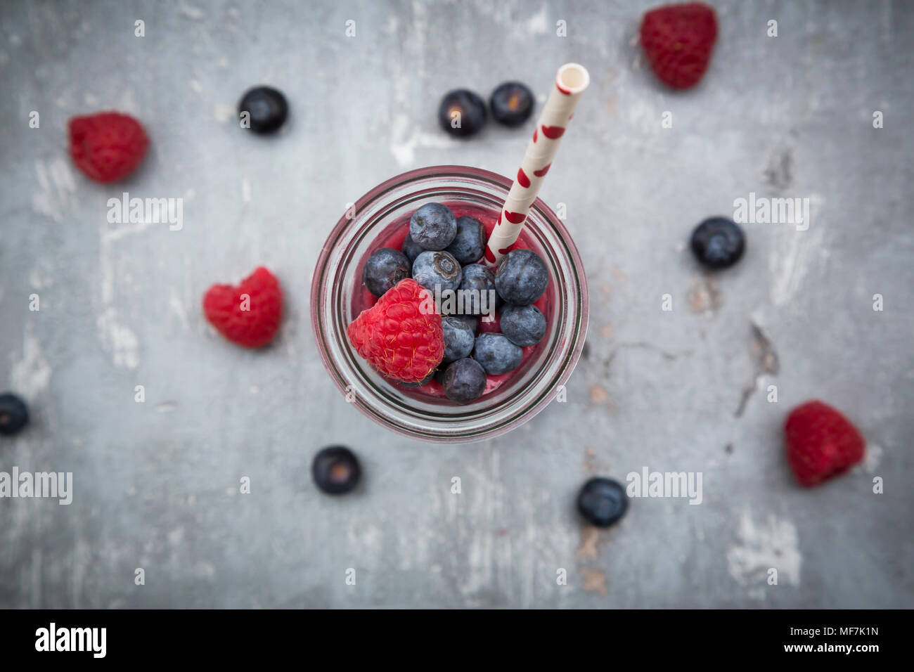 Glass bottle of berry smoothie Stock Photo