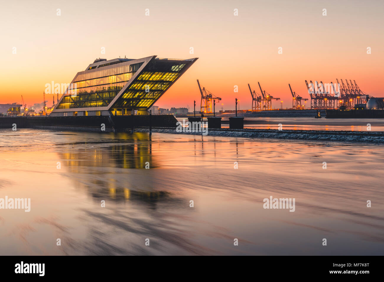 Germany, Hamburg, Dockland, modern office building at sunrise Stock Photo