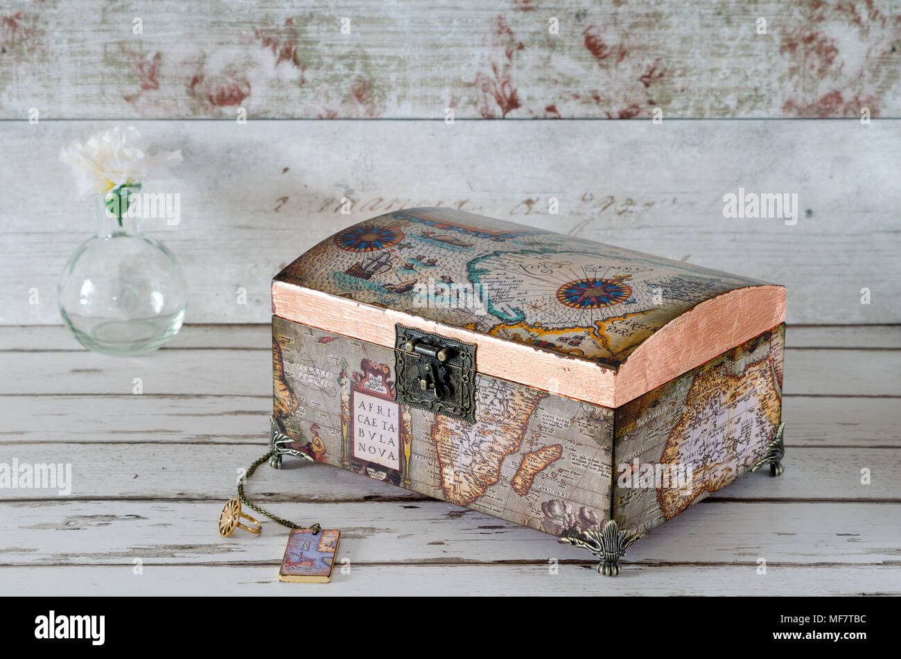 Handmade treasure chest decoupaged with vintage maps and gilded with