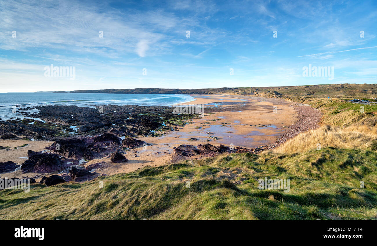 Blue skies over the beach at Freshwater West at Castlemartin in the Pembrokeshire Coast National Park in Wales Stock Photo