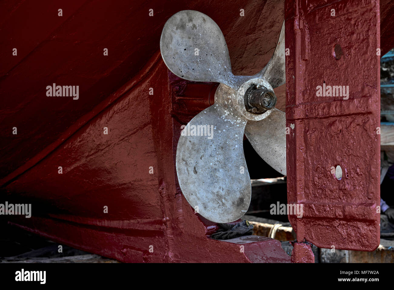 Boat propellor and rudder undergoing dry dock renovation, Thailand
