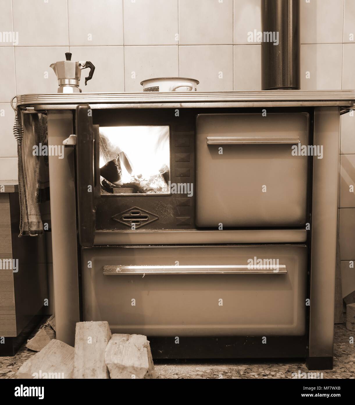 old wood burning stove cooker in the kitchen Stock Photo Alamy