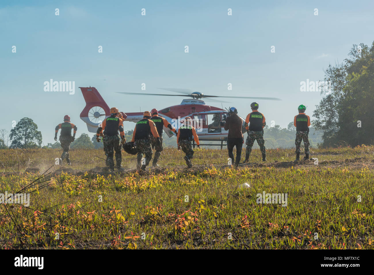 Nakhon Ratchasima, Thailand - December 23, 2017: Rescue team carrying injured paasenger to helicopter to hospital in rescue drill on simulation of pas Stock Photo