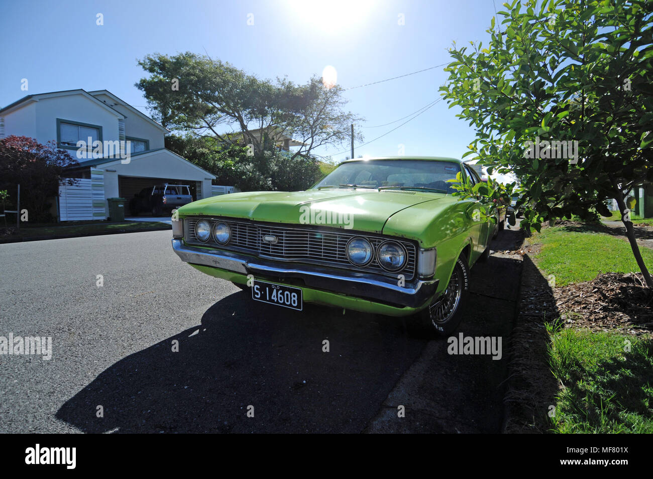 Retro green car on the street in Mermaid Beach Australia Stock Photo