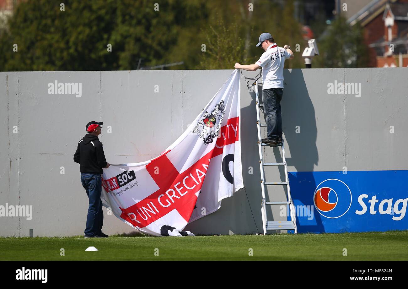 Exeter fans hang Club flags on the side of the pitch before the Sky Bet League 2 match between Exeter City and Crawley Town at St James Park in Exeter. 21 Apr 2018  EDITORIAL USE ONLY FA Premier League and Football League images are subject to DataCo Licence see www.football-dataco.com Stock Photo