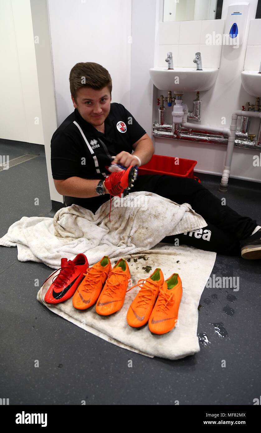 Dave the Crawley Town Kit Man cleans football boots before the Sky Bet  League 2 match between Exeter City and Crawley Town at St James Park in  Exeter. 21 Apr 2018 EDITORIAL