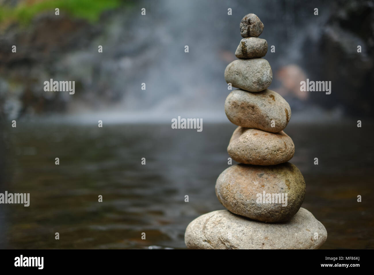 Pebble on the waterfall. The royalty high quality free ...