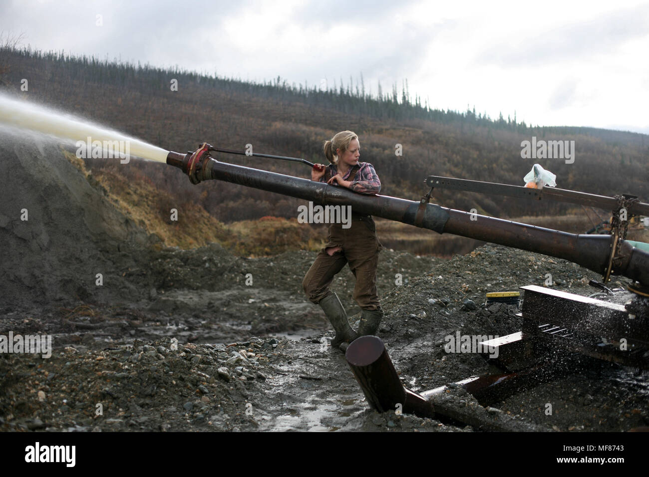 An employee mines gold at Stuart Schmidt Gold Mining near Dawson City