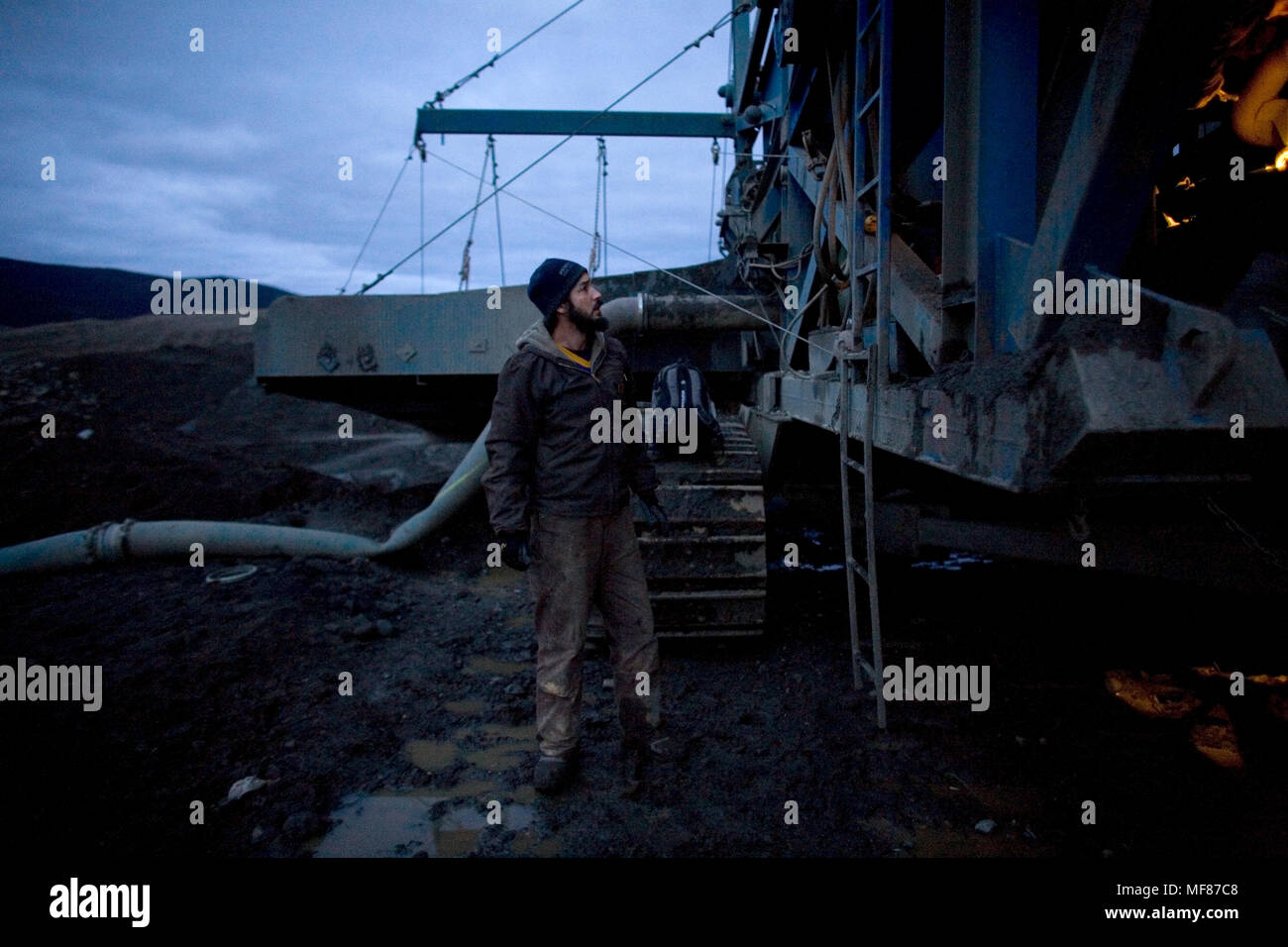 An employee mines gold at Stuart Schmidt Gold Mining near Dawson City