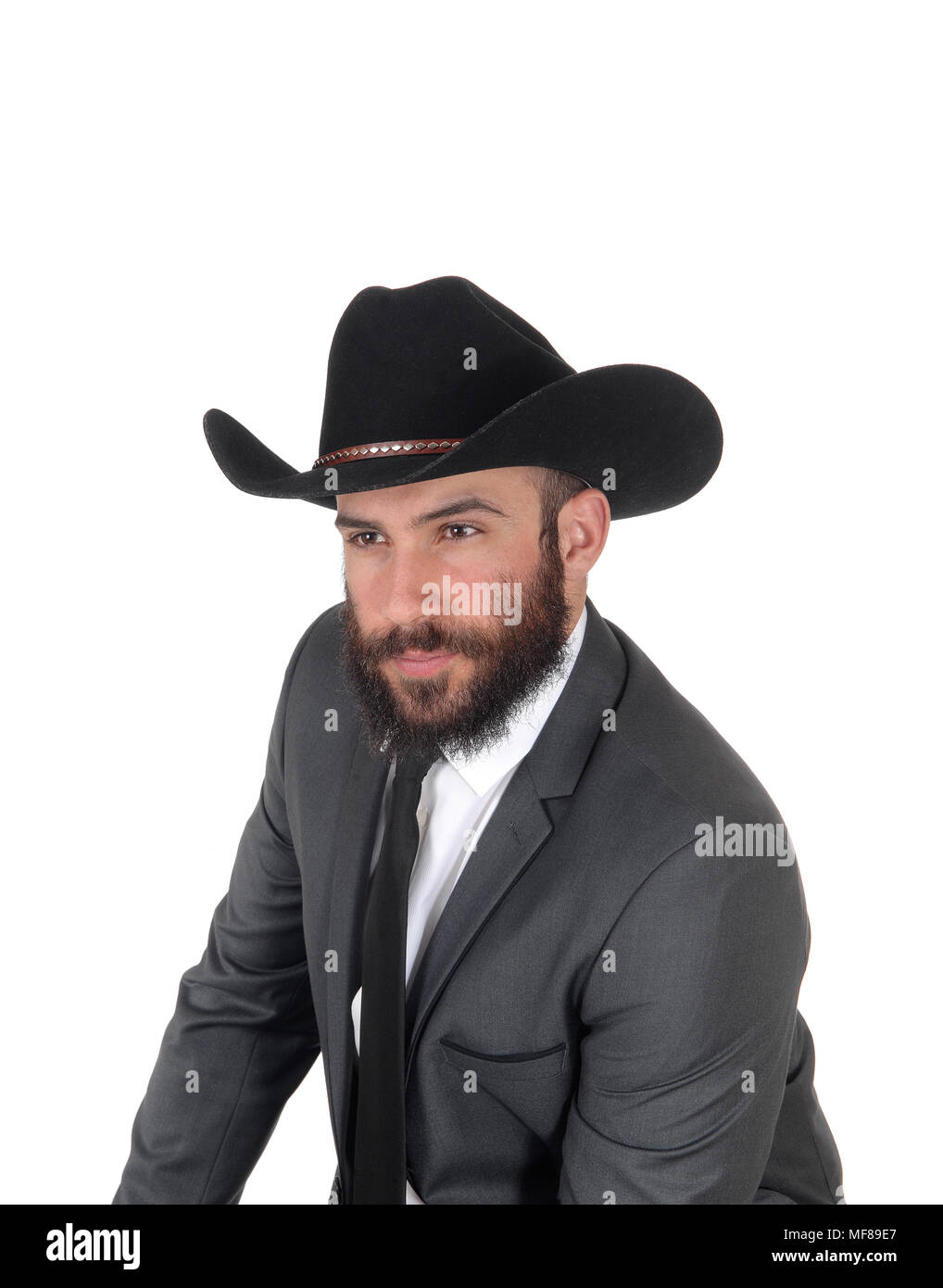 A close up portrait image of a handsome man in a suit and cowboy hat ...