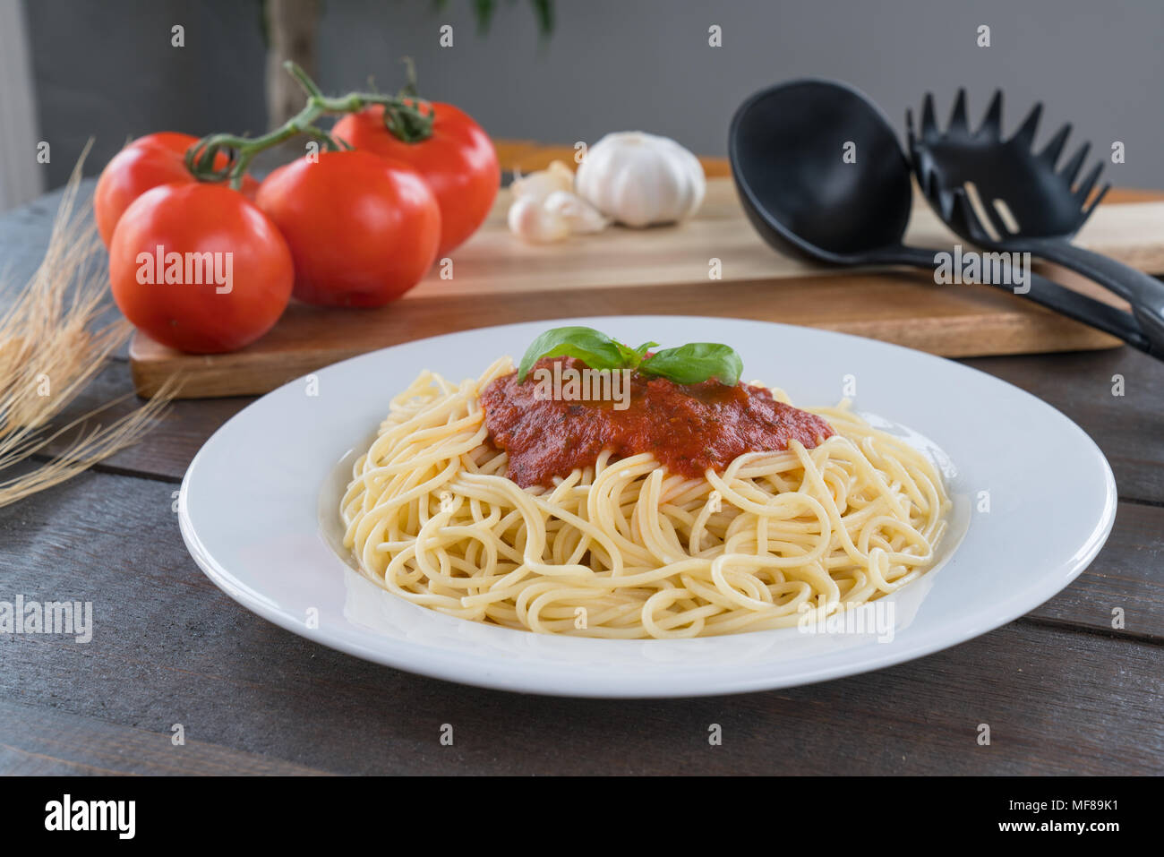 Plate of Spaghetti with tomato sauce and Basil Stock Photo