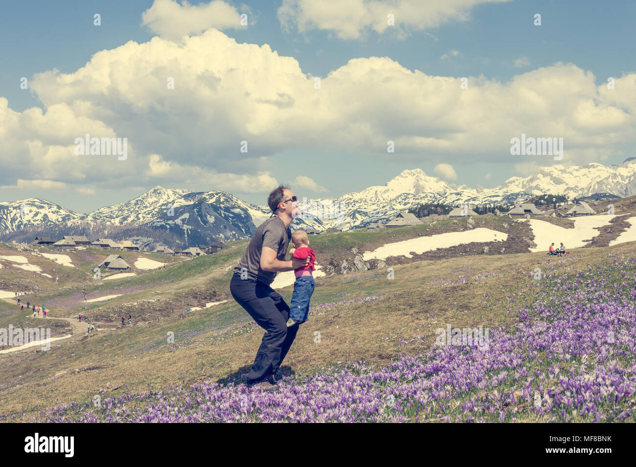 Happy father throwing his child in the air Stock Photo Alamy