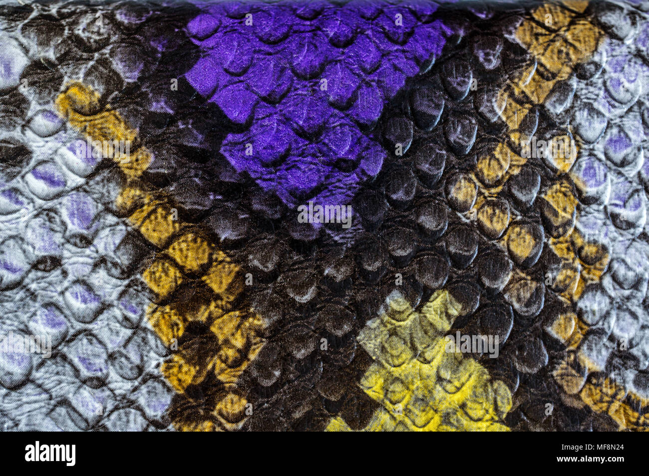 Multicolored faux leather snake Python texture for background. Close up