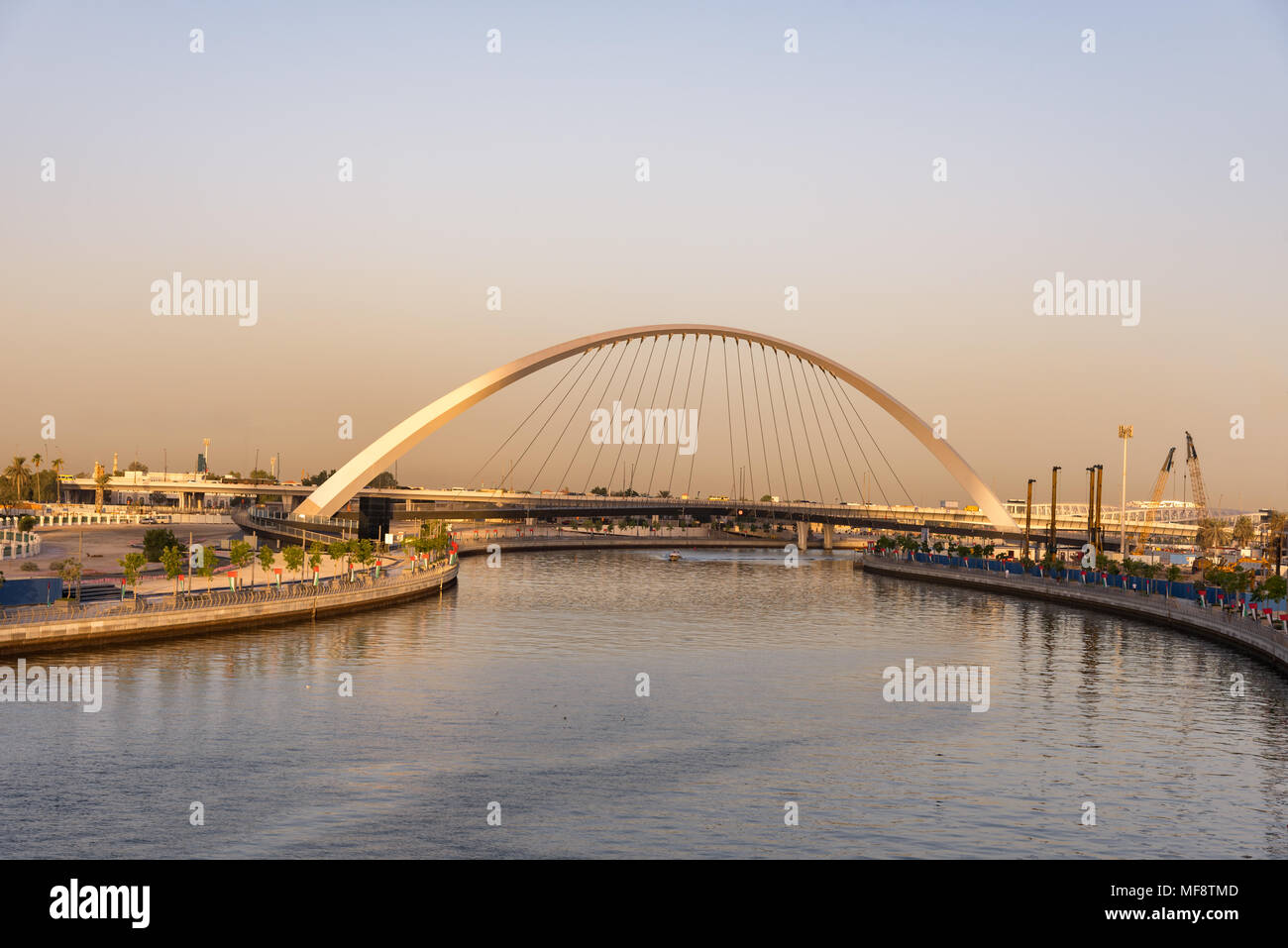 The footbridge view over the new Dubai Water Canal at sunset Stock Photo