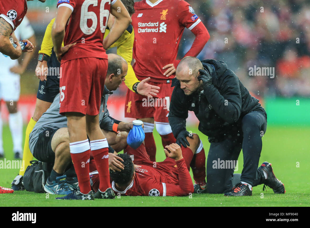 Alex Oxlade-Chamberlain injures his knee after tackling Aleksandar Kolarov of Roma  and is stretchered off during the UAFA Champions League Semi Final, first leg, Liverpool v Roma could this be the end of his season and world cup ? Stock Photo