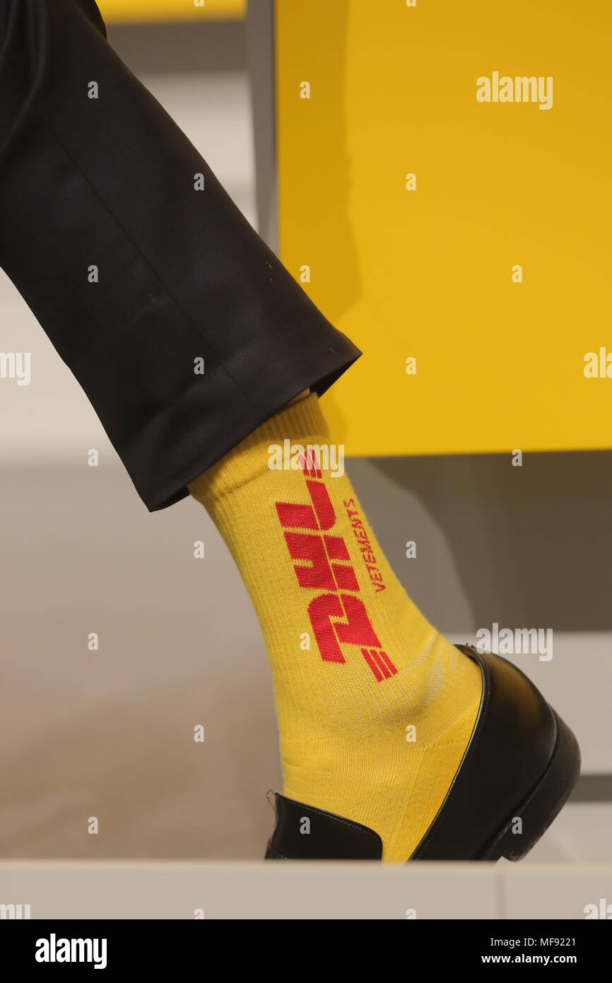 Bonn, Germany, April 24 2018, Deutsche Post DHL annual general meeting:  Executive board member Ken Allen wears yellow socks with DHL logo on it.  Credit: Juergen Schwarz/Alamy Live News Stock Photo - Alamy