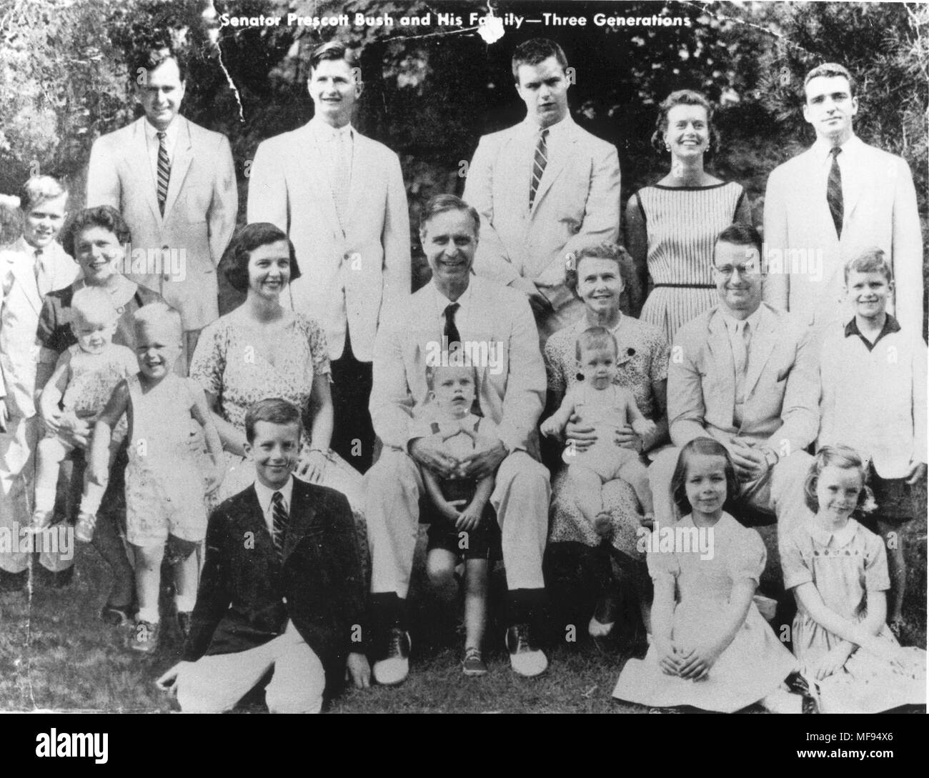 Milton, Massachusetts, USA. 1st Jan, 1956. FILE circa 1956 - United States Senator PRESCOTT BUSH (R-CT), center, and his family. His son, future United States President GEORGE H.W. BUSH (41st President) is in the back row at left, and his grandson, future United States President GEORGE W. BUSH (43rd President) is the young boy farthest at the left. BARBARA BUSH, wife of George H.W. Bush is the woman farthest at left. Son NEIL BUSH is on Barbara's lap and future Florida Governor JEB BUSH is the young boy in shorts in front of her. Credit: White House/CNP/ZUMA Wire/Alamy Live News Stock Photo