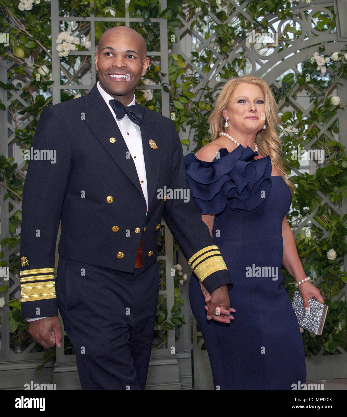Washington, District of Columbia, USA. 24th Apr, 2018. United States Surgeon General Jerome Adams and Mrs. Lacey Adams arrive for the State Dinner honoring Dinner honoring President Emmanuel Macron of the French Republic and Mrs. Brigitte Macron at the White House in Washington, DC on Tuesday, April 24, 2018.Credit: Ron Sachs/CNP Credit: Ron Sachs/CNP/ZUMA Wire/Alamy Live News Stock Photo