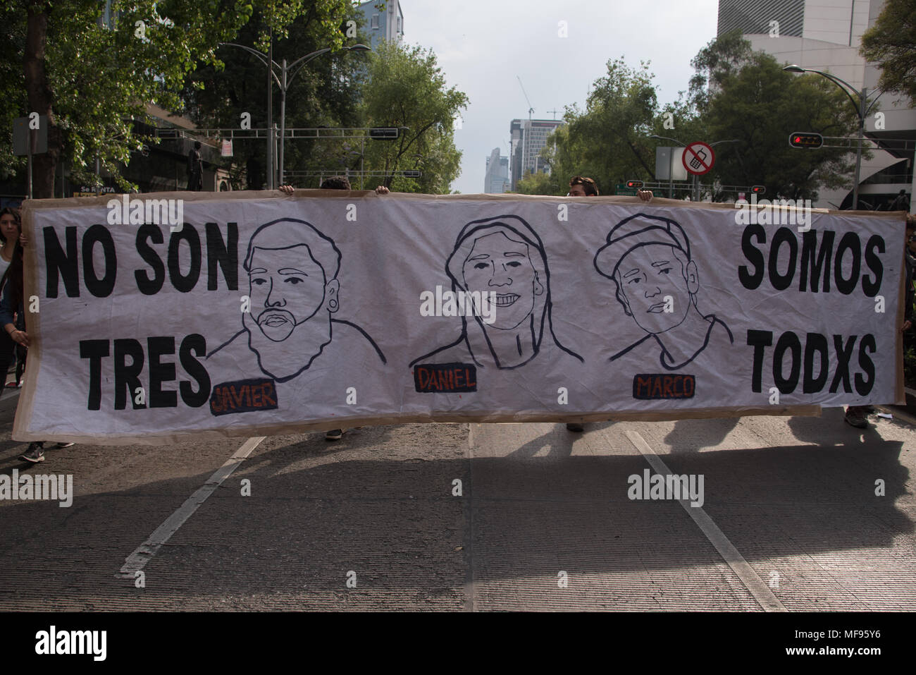 Mexico City, Mexico. 24th April, 2018.  Hundreds of students rallied in Mexico City to ask for justice in the case of the killing of three film students in Guadalajara, Mexico. The banner reads 'No son tres, somos todxs' ('It is not three , it is everyone'). Credit: Miguel A. Aguilar-Mancera/Alamy Live News Stock Photo
