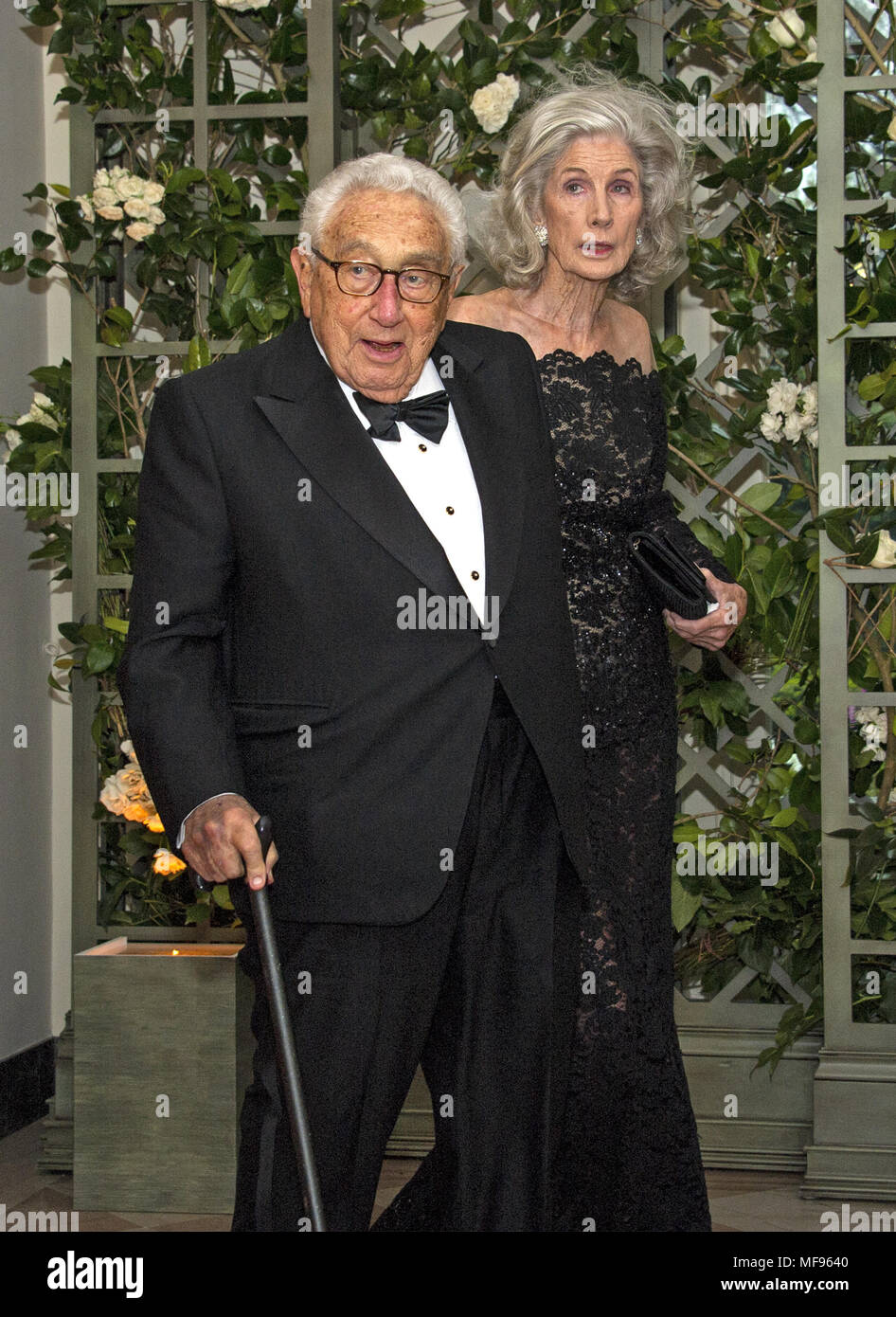 Washington, District of Columbia, USA. 24th Apr, 2018. Former United States Secretary of State Henry A. Kissinger and Nancy Kissinger arrive for the State Dinner honoring Dinner honoring President Emmanuel Macron of the French Republic and Mrs. Brigitte Macron at the White House in Washington, DC on Tuesday, April 24, 2018.Credit: Ron Sachs/CNP Credit: Ron Sachs/CNP/ZUMA Wire/Alamy Live News Stock Photo