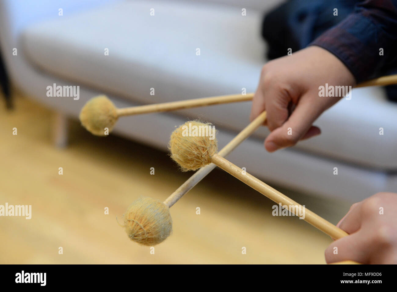 glockenspiel xylophone beaters sticks being held in hands Stock Photo