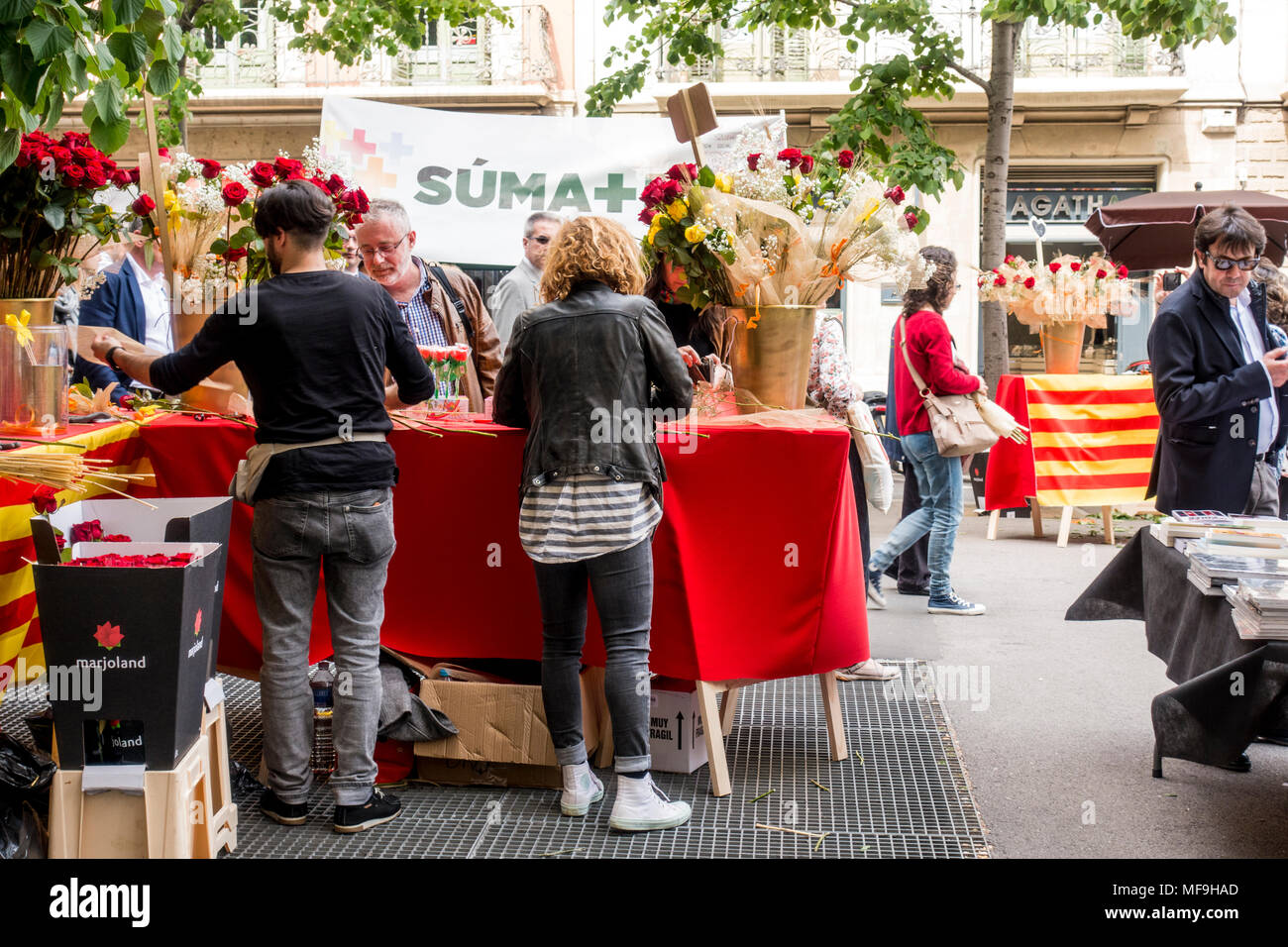 Barcelona, Spain. April 23, 2018: Diada de Sant Jordi or Saint George's Day or The Day of Books and Roses, a famous Catalan celebration. People sellin Stock Photo