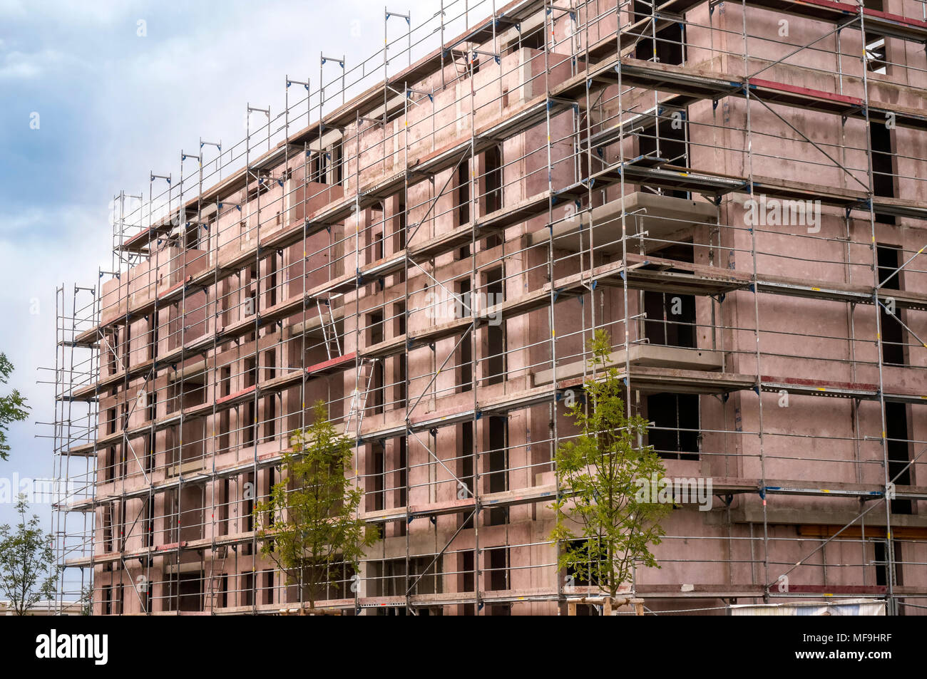 Shell of an apartment building with scaffolding Stock Photo