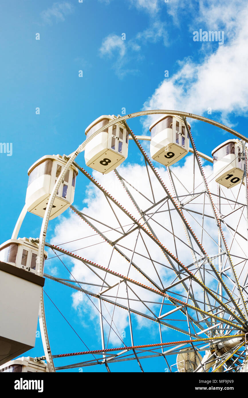 Ferris wheel on the background of blue sky with clouds Stock Photo - Alamy