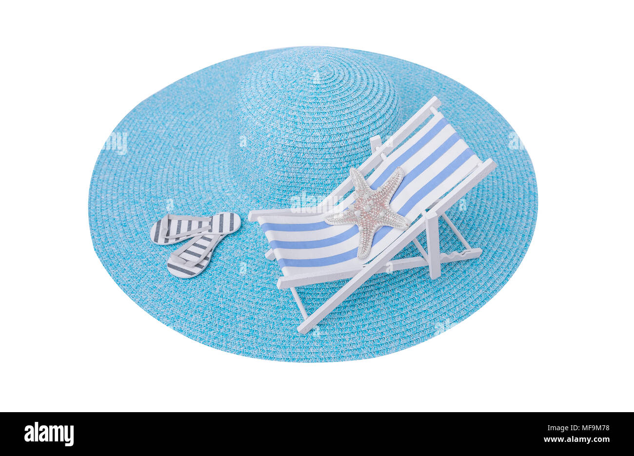 Toy chaise longue on sea hat. Stock Photo