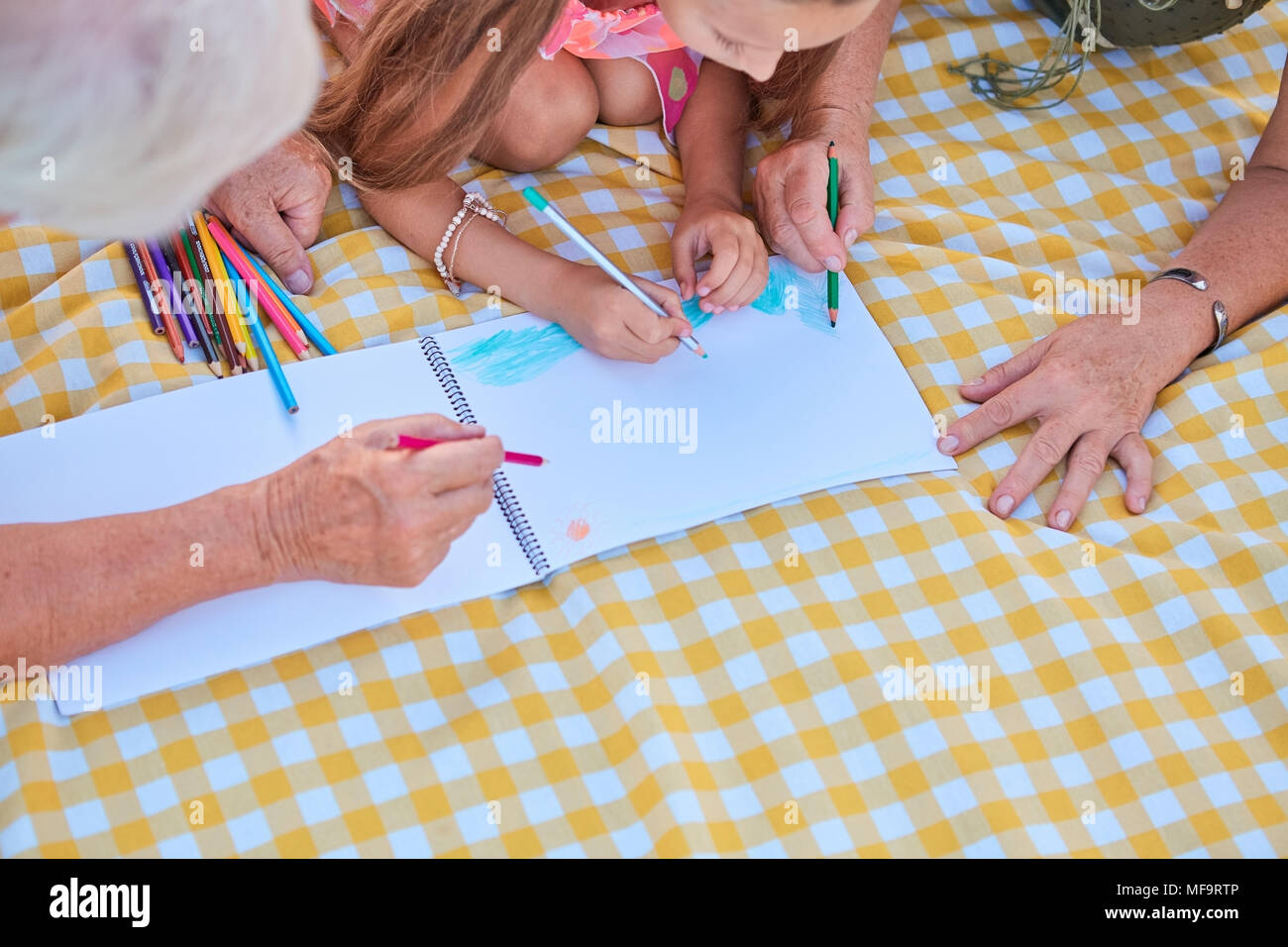 Hands of people drawing. Girl with grandparents. Generations and ...