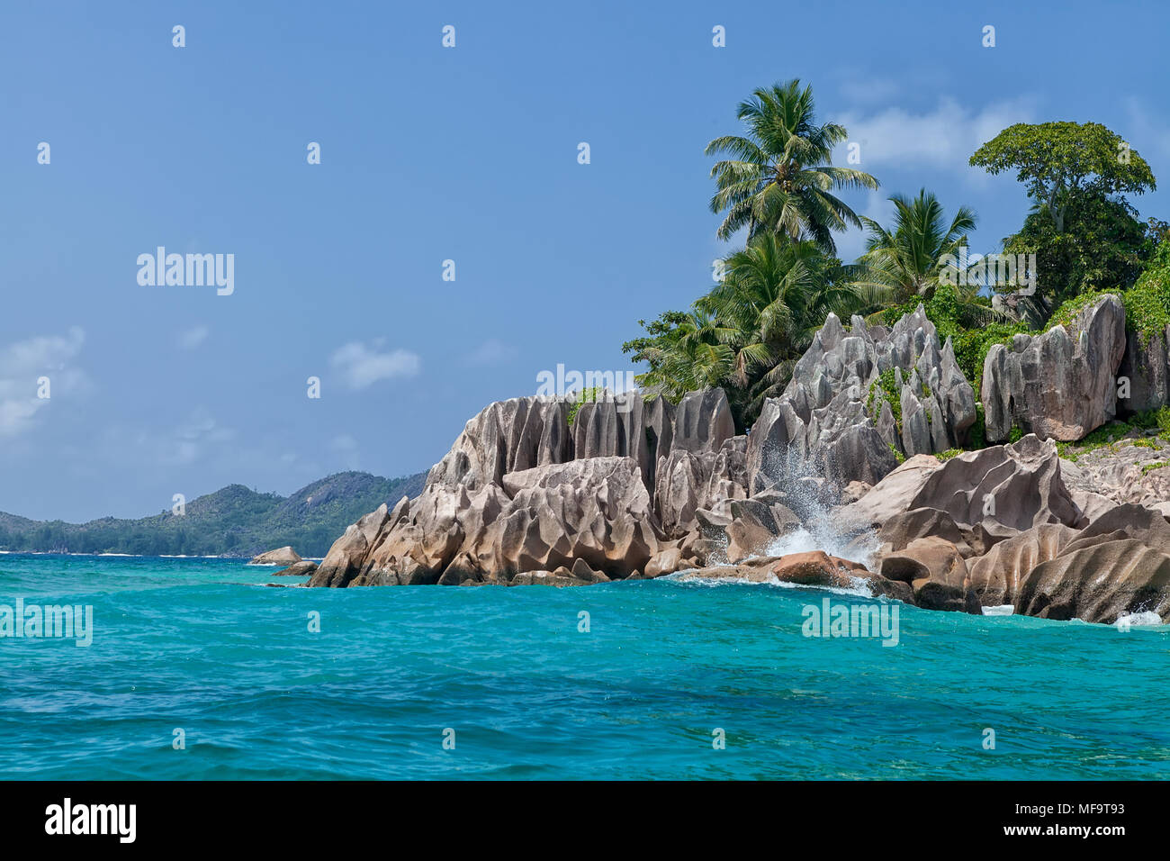 Beautiful tropical St. Pierre Island with palms and granite rocks, Seychelles Stock Photo
