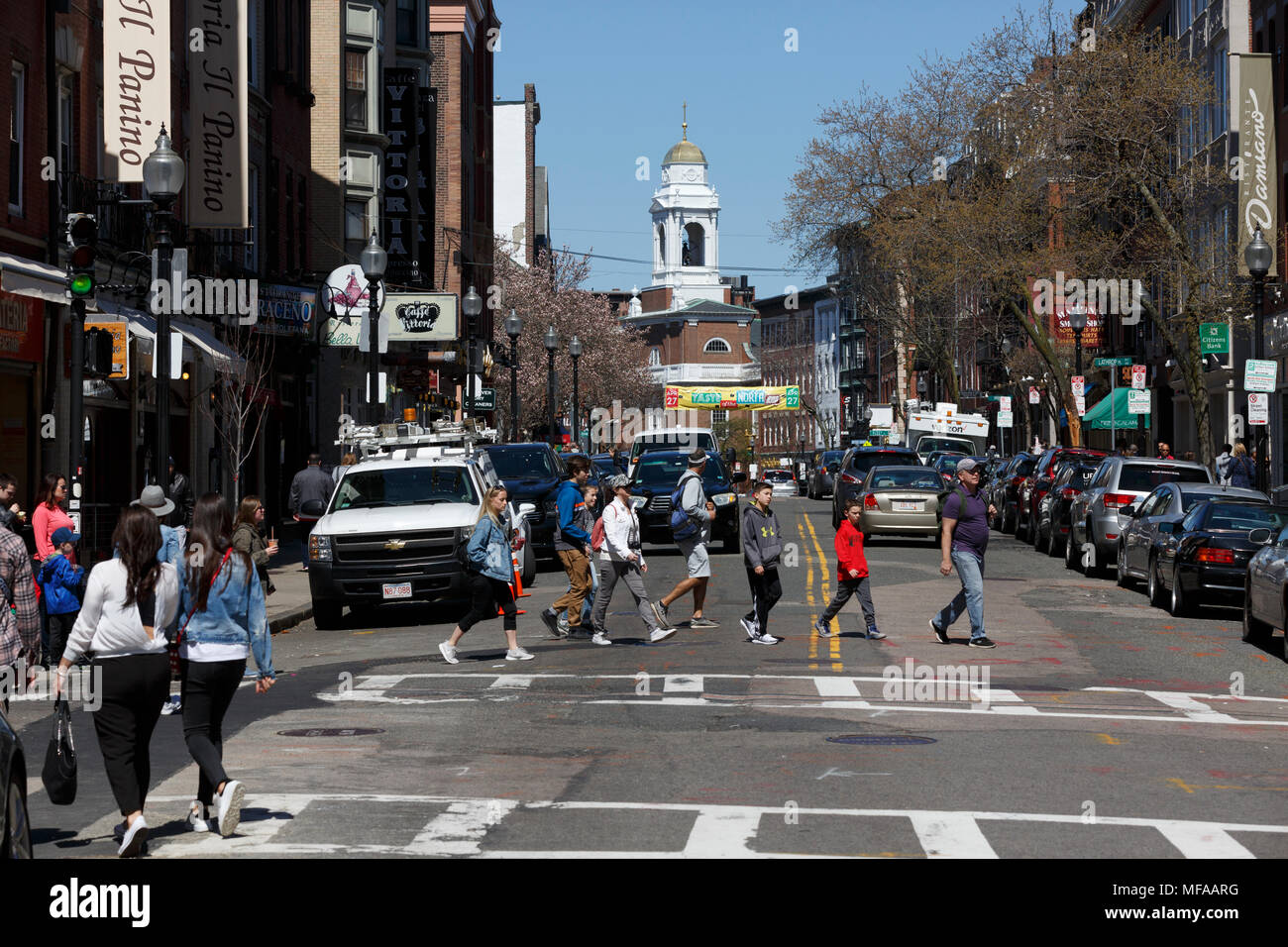 Pedestrians crossing busy Hanover Street in the North End, Boston
