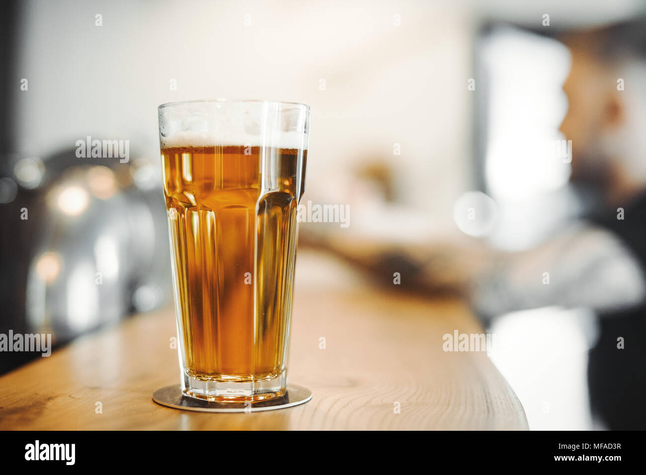 Beer glass stands on bar counter Stock Photo Alamy