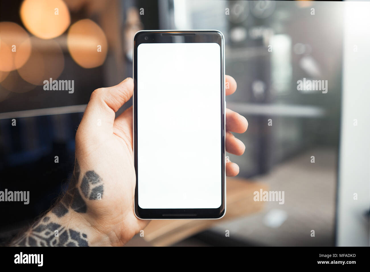 Cell phone in left hand hires stock photography and images Alamy