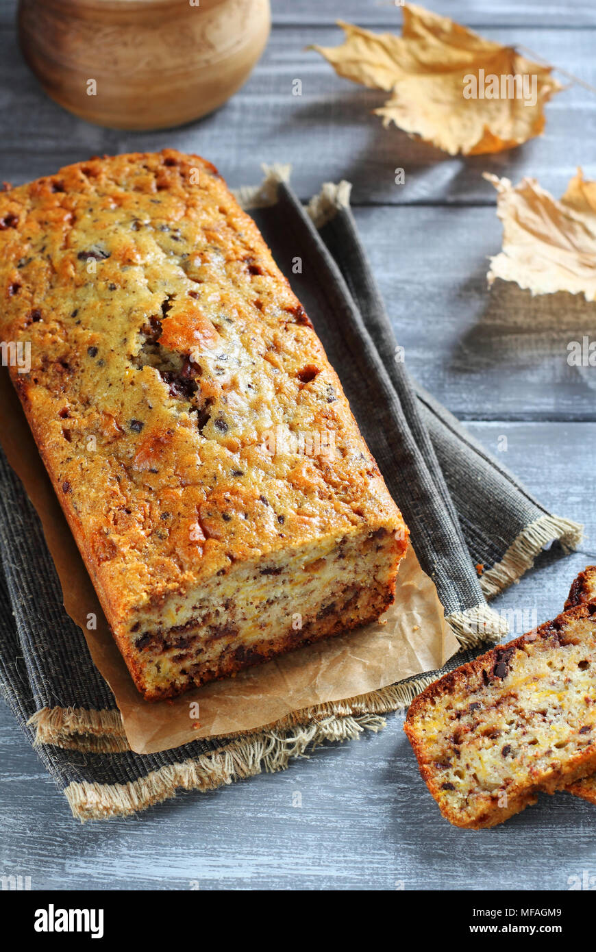 Cut pumpkin cake with chocolate on the gray boards. Top view. Seasons Autumn. Stock Photo