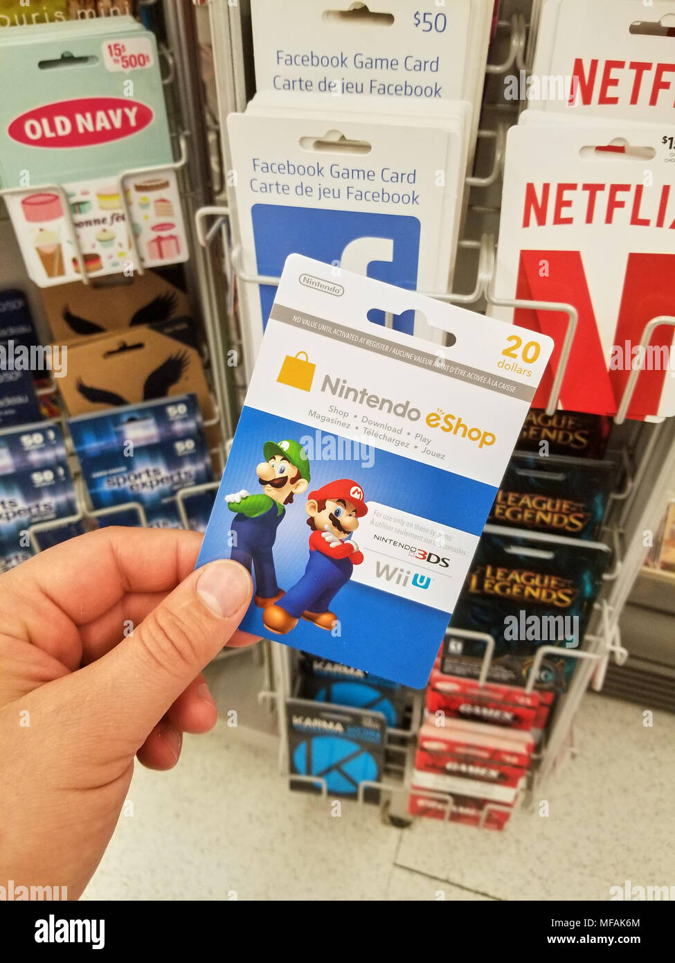 MONTREAL, CANADA - MARCH 31, 2018 : A hand holding a Nintendo gift card. Nintendo  eShop is a digital distribution service powered by Nintendo Network Stock  Photo - Alamy