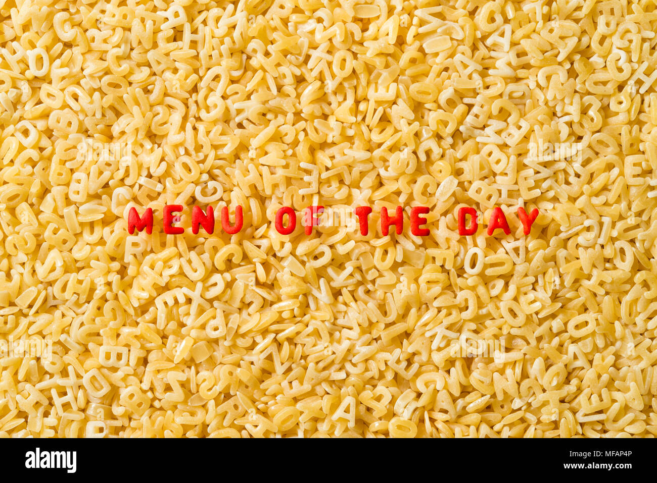 Menu of the day spelled with uncooked alphabet pasta Stock Photo Alamy